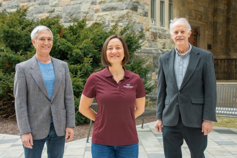 Left to right, John Simonetti, Alma Robinson, and George Glasson pose in front of a campus building adorned with Hokie Stone. Photo for Virginia Tech by Melissa Vergara. 